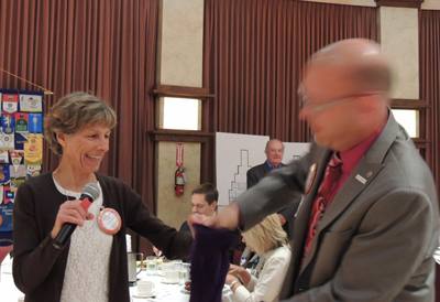 Judy Glenn offers Mike Kalhoff a chance to pull the winning card