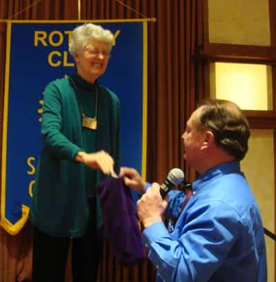 President Peggy tries really hard to pick the winning card from Doug Johnson